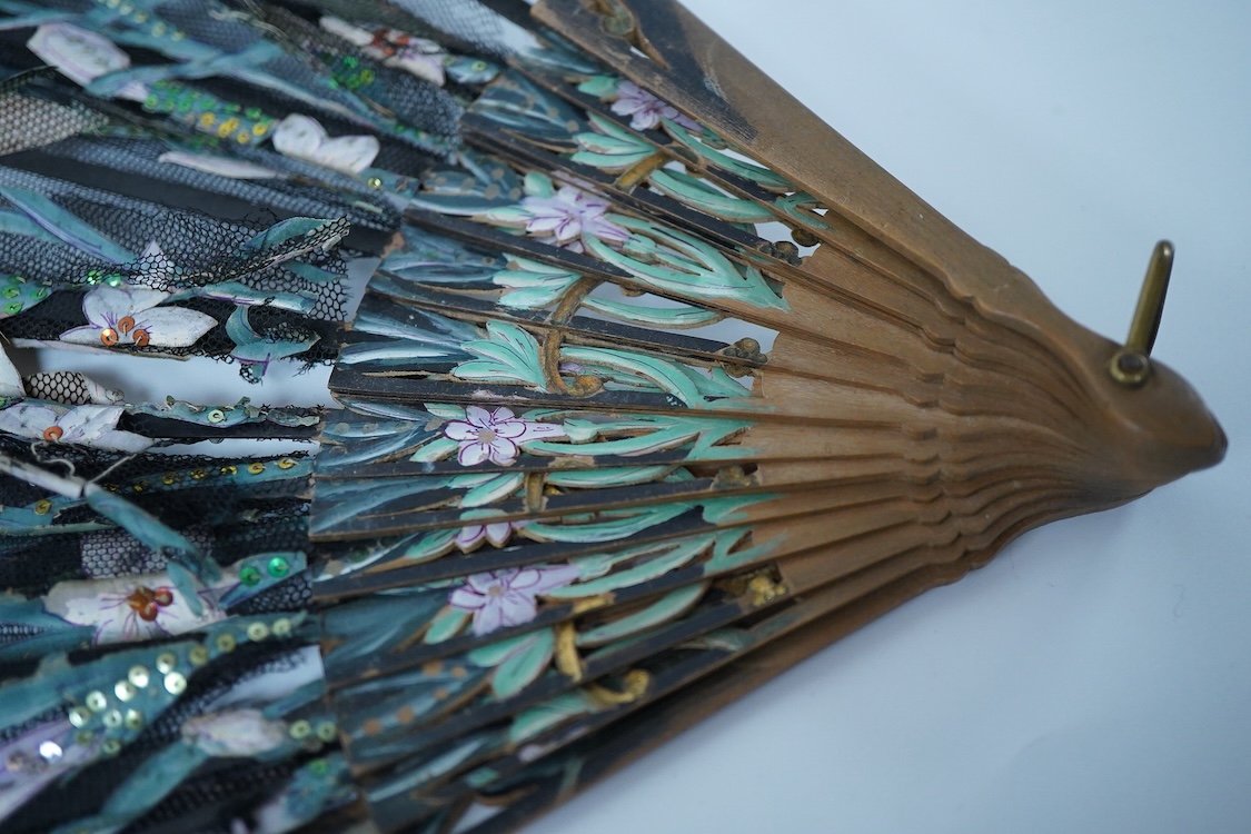 A collection of 19th century and later fans to include a black lacquered and lace example and a hand painted floral example